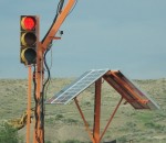 a solar panel powers an emergency stoplight in a construction zone