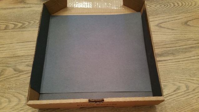 line the box with black construction paper